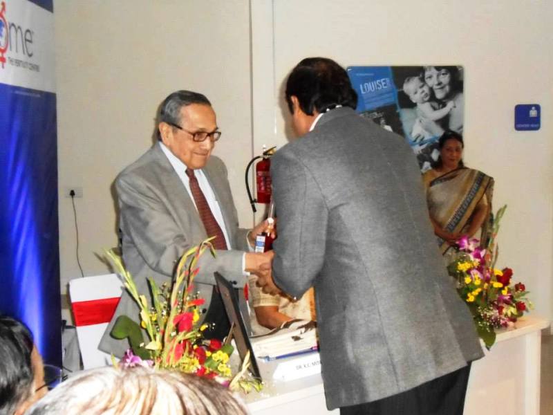 Dr. K. C. Mitra being feliciated by Mr. P. L. Mehta